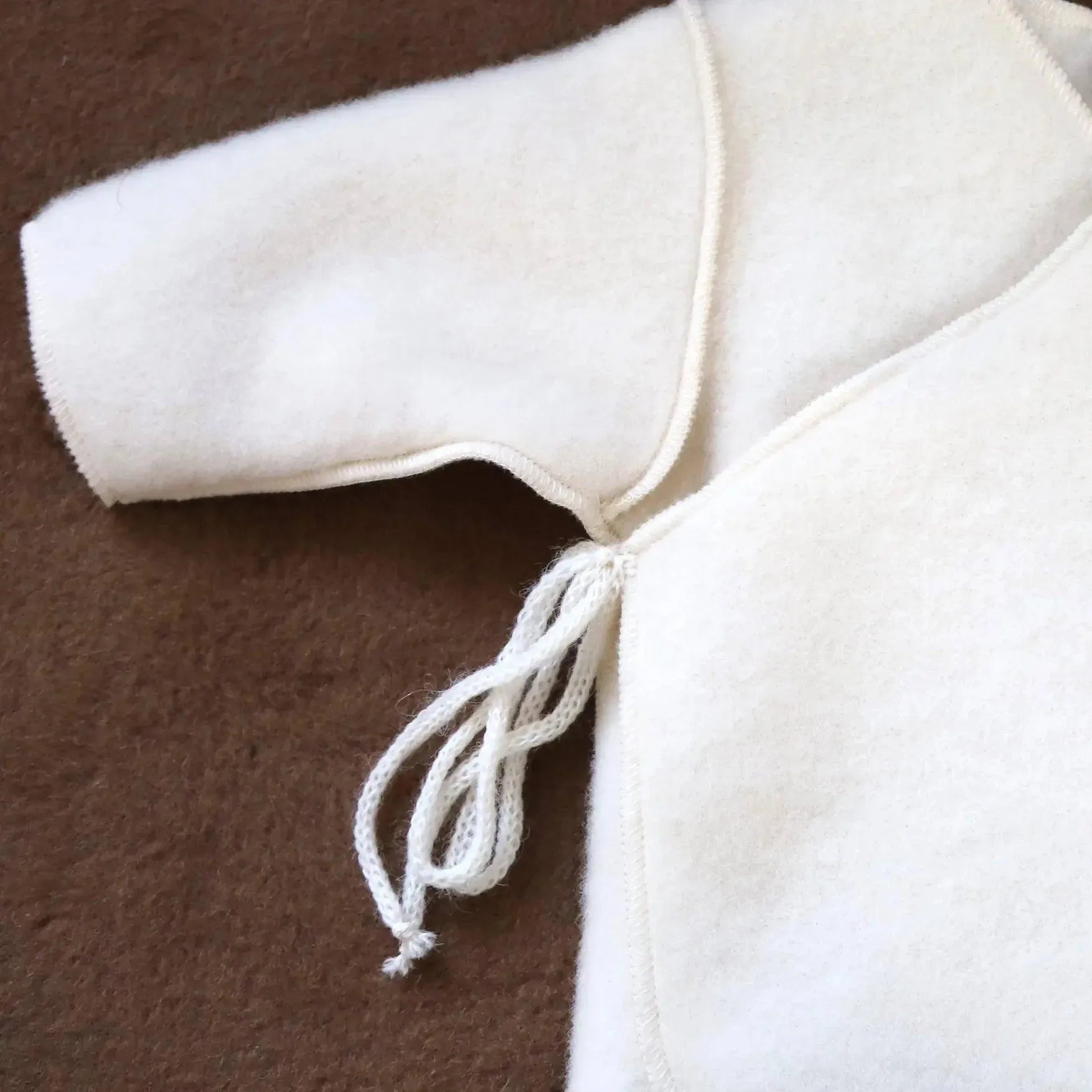 Cardigan Neonato in Pura Lana Merino – Morbida e Calda